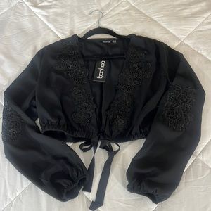 Black Top from Boohoo. With details of lace. Ties under bust.